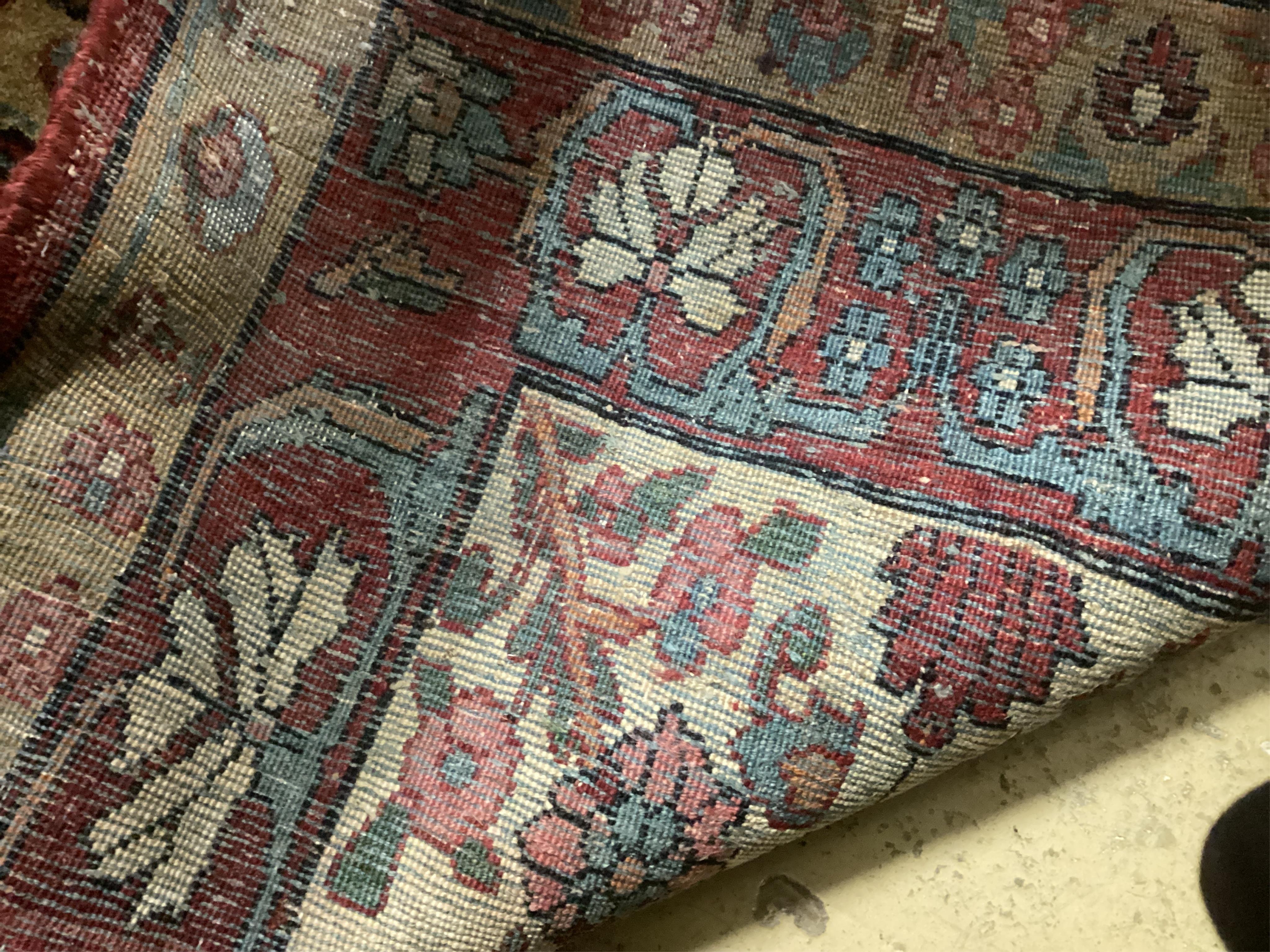 An Agra multi coloured carpet, the ground woven with interlocking oval medallions, 455 x 315cm